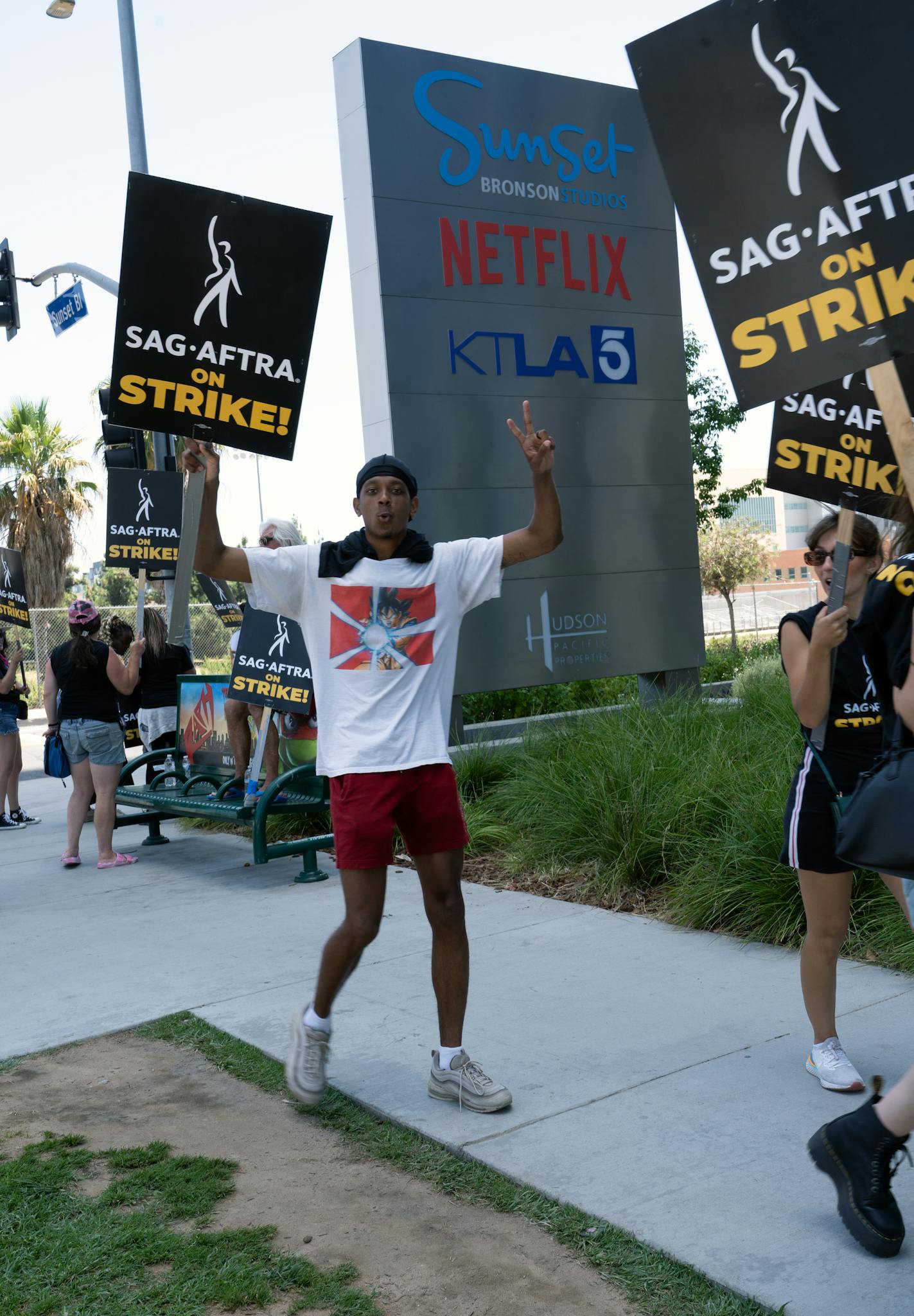 Protesters holding banners outside Netflix building for SAG-AFTRA strike.